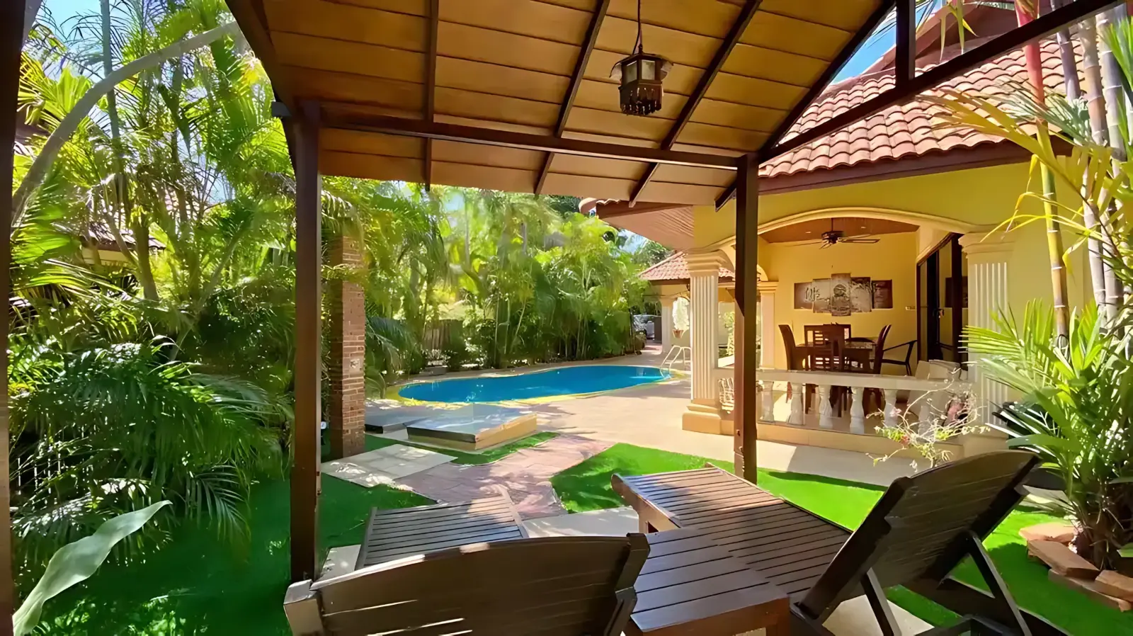 Coconut Paradise Villa garden with coconut trees